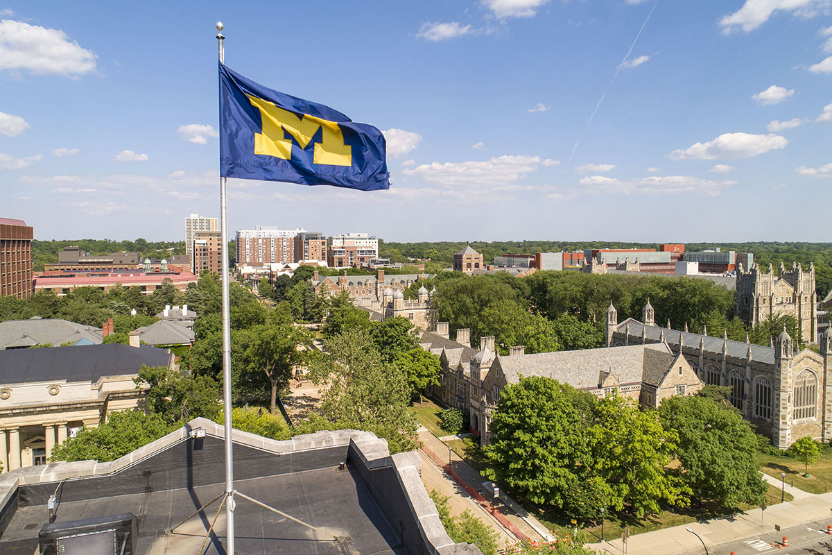 The Block M flag flies over the Michigan Union