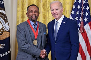 Earl Lewis on stage with President Joe Biden during an event for the Arts and Humanities Award Ceremony in The East Room of The White House in Washington, DC on March 21, 2023.